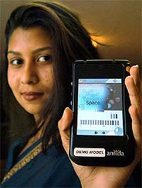 A model shows Amida Simputer during its launch in Bangalore