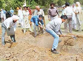 Residents of Sector 21-A, Chandigarh, fill up the foundation of a ‘sehaj safai kendra’ on Saturday to prevent the public park from getting polluted