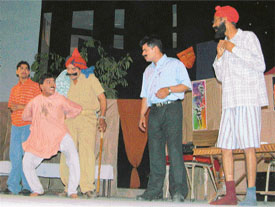 Artistes perform a play Mirch Masala on the occasion of World Theatre Day at Punjabi Bhavan