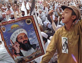 A Pakistani child chants slogans against the Pakistan Government