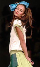 A model presents a creation by Portuguese designer Osvaldo Martins