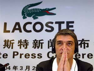 Philippe Lacoste, director of French retail giant Lacoste and grandson of founder Rene Lacoste, gestures during a news conference in Shanghai