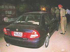 A Lancer car with Delhi registration number that was used by henchmen of a land-mafia at the time of assaulting The Tribune team in Dhakauli village, near Zirakpur, on March 22