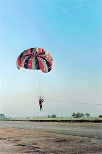 A parasailor is ready to land
