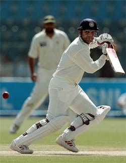 Virender Sehwag hits a boundary off Shoaib Akhtar 