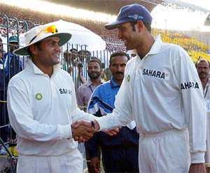 V.V.S. Laxman congratulates team-mate Virender Sehwag for breaking his record of being the highest Indian run scorer in a Test innings