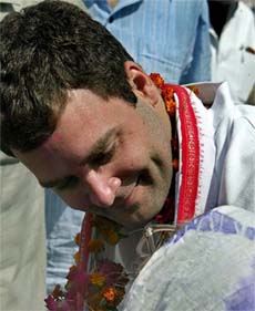 Rahul Gandhi talks with an elderly village woman at a village in Amethi constituency