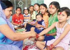Girls being worshipped at an Ashtami puja in Ludhiana