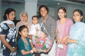 Amritpal Singh with his family members after the felicitation function in Ludhiana on Saturday night