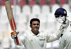 Virender Sehwag waves to the crowd after reaching his triple century on the second day of the first Test against Pakistan in Multan 