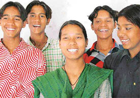 Slum kids of Sector 25 Janata Colony pose for picture after clearing the Class V 