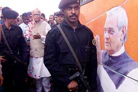 Supporters shower flower petals on Deputy Prime Minister L.K. Advani as he approaches his Bharat Uday Yatra rath in Ahmedabad