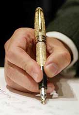 The hand of Jan-Patrick Schmitz, CEO, Montblanc, North America, is seen writing with the worlds most expensive pen, Montblancs Meisterstck Solitaire Royal diamond fountain pen valued at $ 1,25,000 in New York.