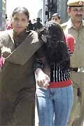 One of the call girls arrested during the raid on a hotel. 