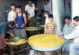 The 5.5 quintal "ladoo" being prepared at Hanuman Mandir, Phase 3B2, in Mohali on Saturday.