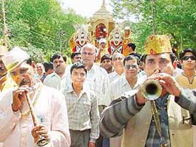 Devotees take part in a rath yatra on the occasion of Mahavir Jayanti in Sector 18, Chandigarh, on Saturday. 