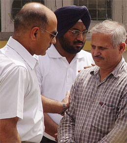 Air Officer Commanding, Air Force Station, Ambala, Air Commodore L K Malhotra consoles Flight-Lt Gagan Oberoi's father, Mr D K Oberoi, in Ambala on Sunday. 