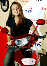 Bollywood actress Priety Zinta sits on a TVS Pep scooter 