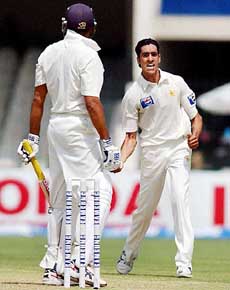 Pakistan's Umar celebrates after dismissing V.V.S. Laxman on the first day of second Test 
