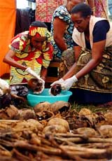 Women wash human skulls discovered in a recently found mass grave in Kigali's neighbourhood of Nyamirambo on Monday