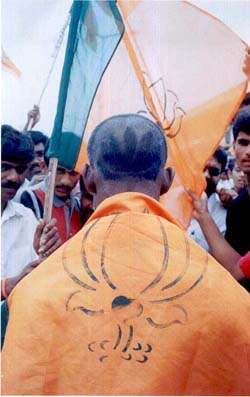 A BJP activist with his head shaved in the shape of a lotus at a party procession in Chikmangalur 