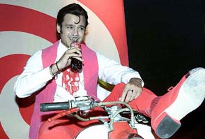 Bollywood actor Vivek Oberaoi dressed as Elvis Presley at the launch of new Coke product 'Wakaw'