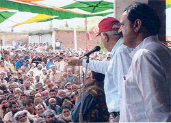 Dr Farooq Abdullah, former Chief Minister of Jammu and Kashmir, addresses an election rally in Rajouri district on Wednesday. The candidate for the Jammu Lok Sabha seat stands beside him.