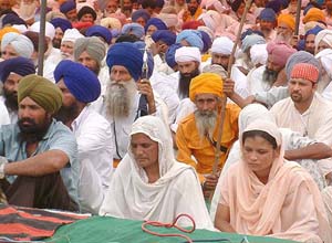 Amarjeet Kaur and Gian Kaur, widow and mother of Angrej Singh, at the bhog ceremony at Bakipur village in Tarn Taran on Wednesday.