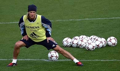 Real Madrid's British midfielder David Beckham stretches during a training session in Madrid on Thursday. Posh Spice Victoria Beckham insisted on Tuesday