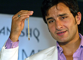 Bollywood actor Saif Ali Khan displays a gold chain with diamond locket during the launch of a new range of diamond jewellery in New Delhi on Friday. In India, models, film actors and sports personalities are often used as brand ambassadors to endorse products.