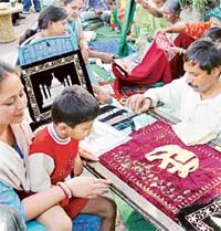 Master craftspersons show their craft during the Akhil Bharatiya Dastkar Samiti exhibition