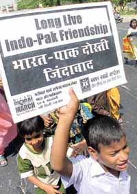 Children shout slogans during a march titled "Peace for Children, Children for Peace"
