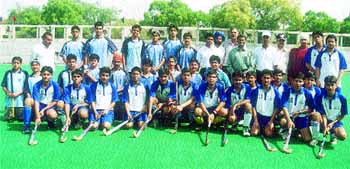 Former Olympian Ashok Kumar with the Ganga and Mota Singh School teams before the start of the D P Joshi Memorial Inter-School Hockey Tournament