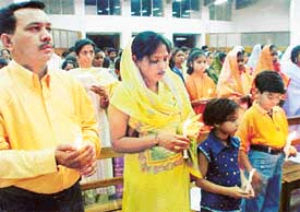Devotees pray on the eve of Easter at the Sector 19 Cathedral, Chandigarh