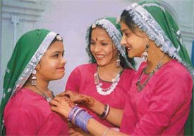 Students of New Public High School dress one another for the annual prize distribution function in Ludhiana 