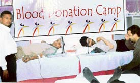 Donors at a blood donation camp held at the office of Amway India in Ludhiana 