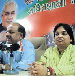 Congress Councillor Kusum who joined the BJP with BJP Delhi Pradesh president Dr Harsh Vardhan at a press conference in the Capital
