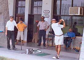 Mr Colin Field watch ace golfer Harmeet Khalon at the CGA Range on Sunday