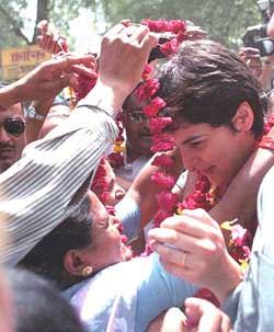 Priyanka Gandhi is garlanded by party workers in Rae Bareli as she campaigns for her mother and AICC President Sonia Gandhi