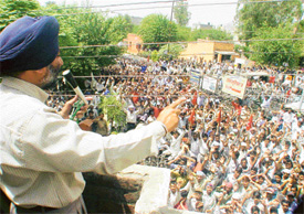 CPM leader Sukhwinder Singh Sekhon addresses an industrial workers’ rally