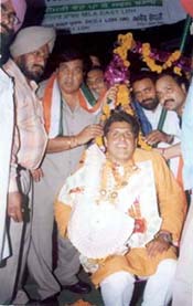 The Congress candidate from Ludhiana, Mr Manish Tiwari, being weighed against coins at New Cycle Market on Gill Road
