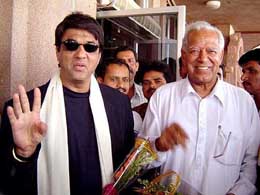Actor Mukesh Khana and Dara Singh arrive at Bhubaneswar airport to campaign for the BJP on Sunday