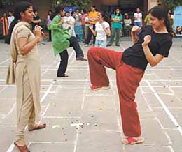BEST FOOT FORWARD: Girls displaying their footwork during the launch of the Electrolux Femme Force self-defence programme at Vasant Kunj in the Capital on Sunday. 