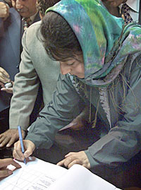 Ms Mehbooba Mufti, president of the Peoples Democratic Party, signs her nomination papers in Anantnag on Monday.