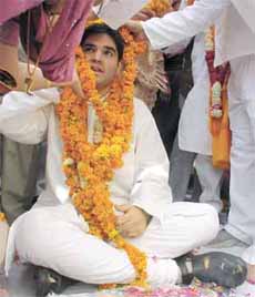 THE FLOWER OF BJP SHOW: Varun Gandhi being garlanded during a public meeting of the party in the Capital on Tuesday.