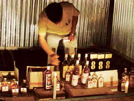 Tin sheds are being used to sell liquor in candlelight in southern sectors of Chandigarh. 