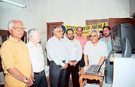 Randeep Wadhera, physically challenged writer, is all smiles after receiving a computer system from a State Bank of Patiala team in Panchkula on Tuesday.