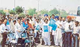 BSP workers take out a scooter rally to mark Ambedkar Jayanti in Ludhiana on Wednesday.