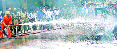 Delhi Fire Service personnel giving a demonstration in firefighting techniques during the Fire Service Week at Barakhamba Road in the Capital on Wednesday.
