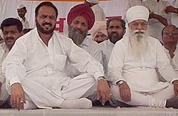 Mr H. S. Hanspal, president of the Punjab Pradesh Congress Committee, and Mr Harminder Jassi, chairman, Markfed, at a conference at Talwandi Sabo on the occasion of Baisakhi Mela